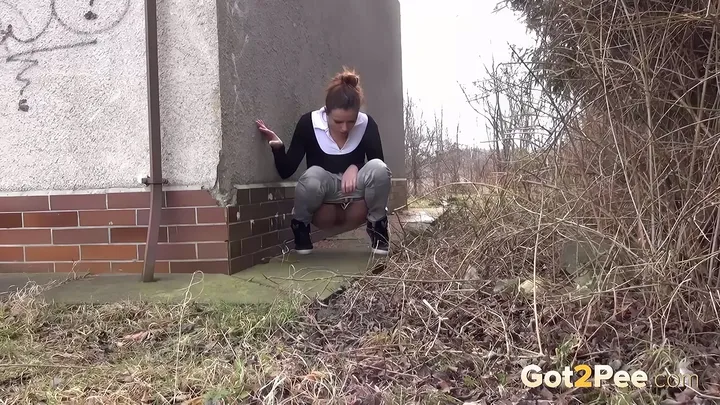 Outdoor Pissing: Brunette Urgently Relieves Herself on a Quiet Road - scat porn video at ScatPuke.com